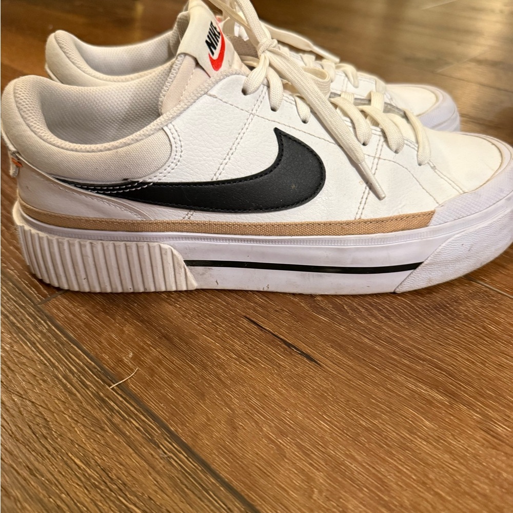 Nike White Sneakers with Black Swoosh and Red Logo